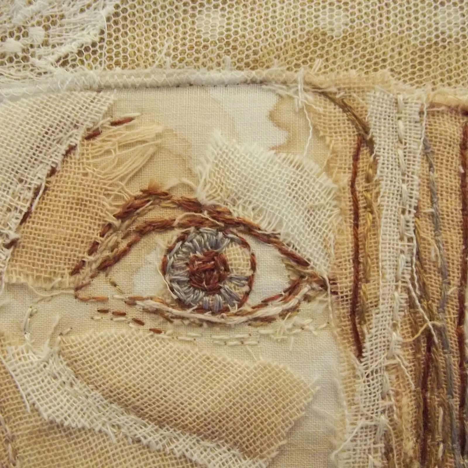 A close up of an embroidered eye