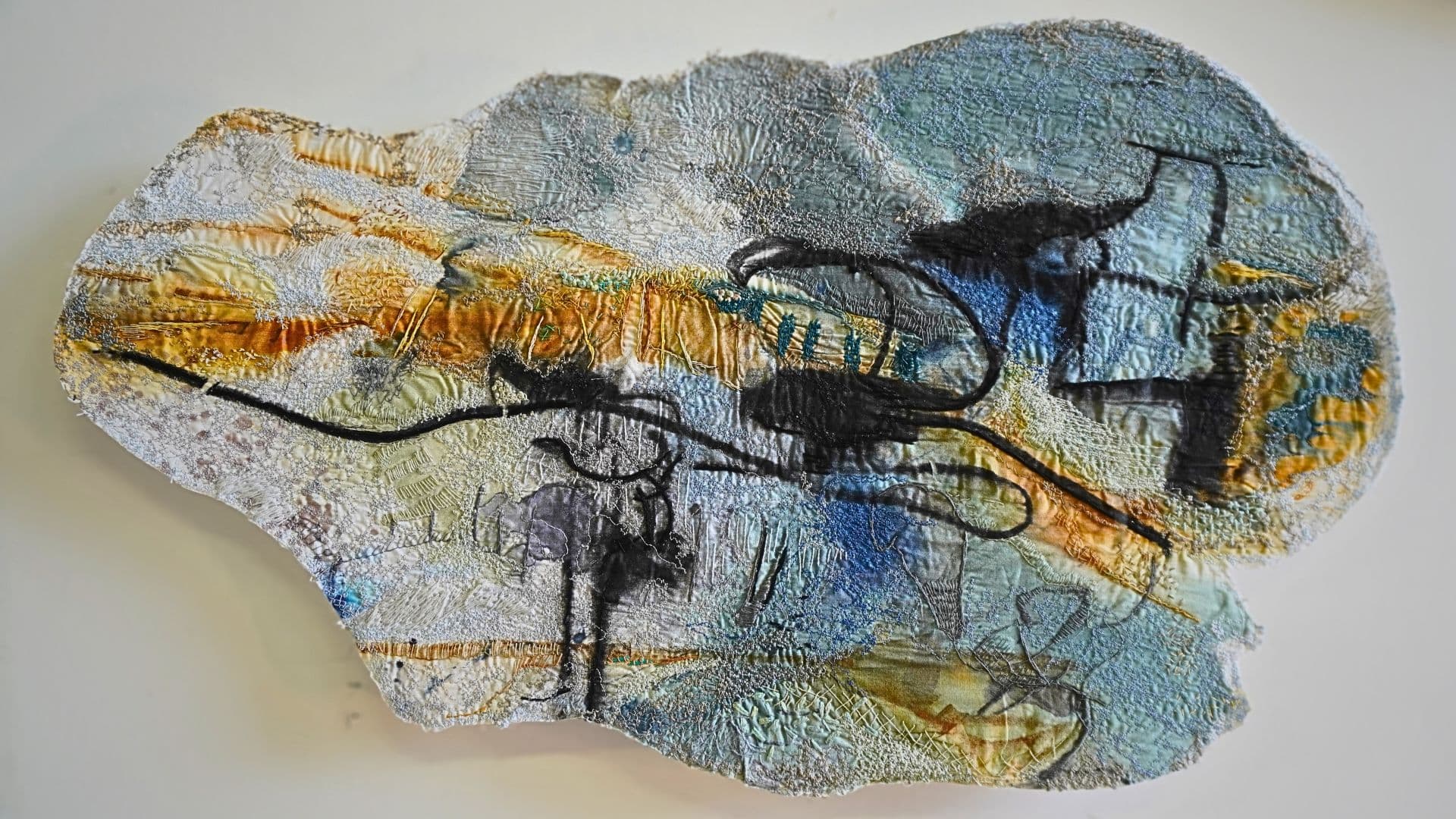 Textile artwork of landscapes made by painting, drawing and hand and machine stitching.