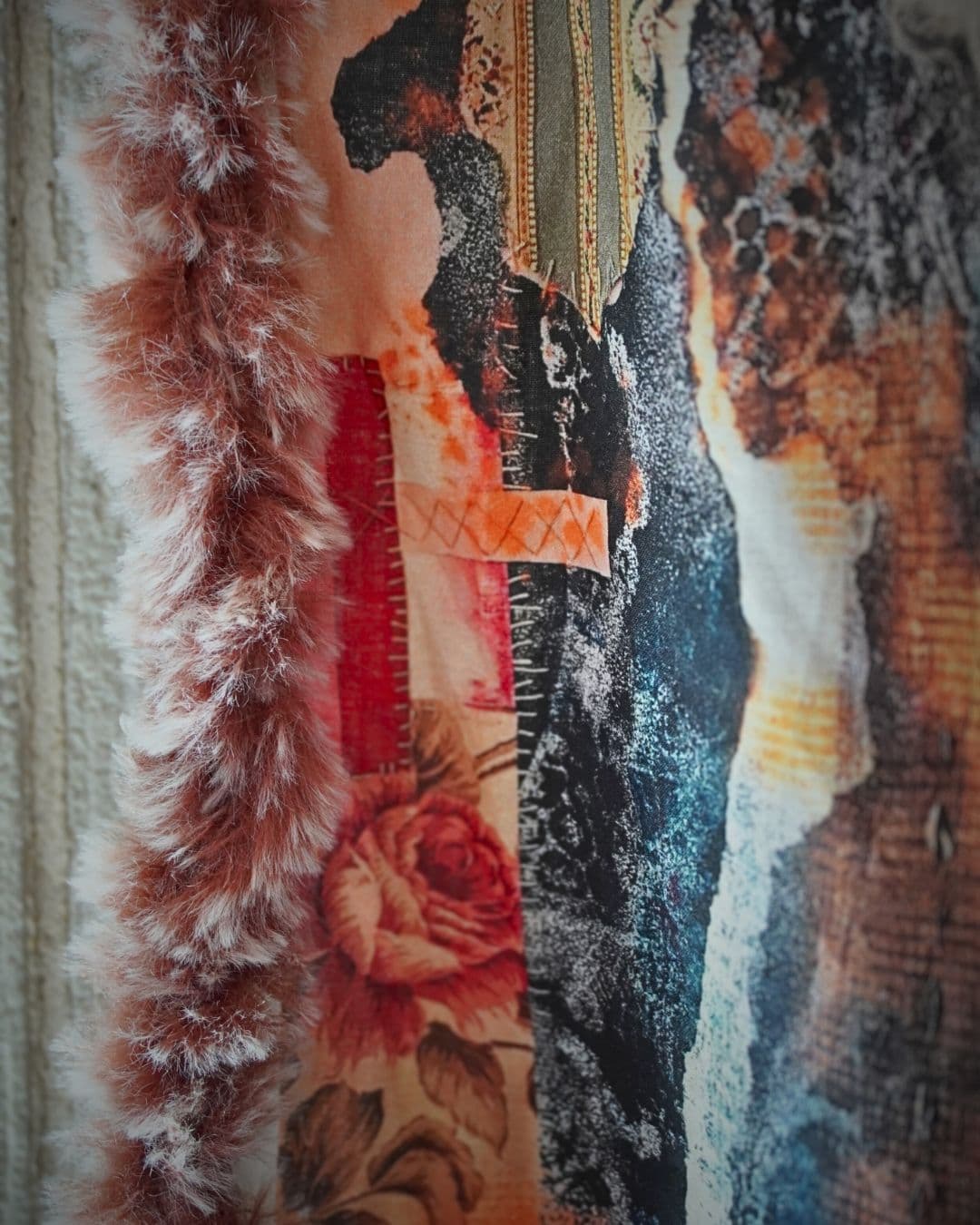 Textured fabric artwork with abstract patterns.