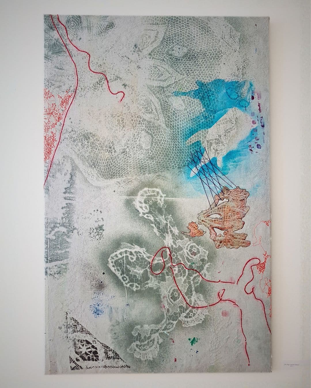 Abstract landscape textile art with vibrant textures and colours.