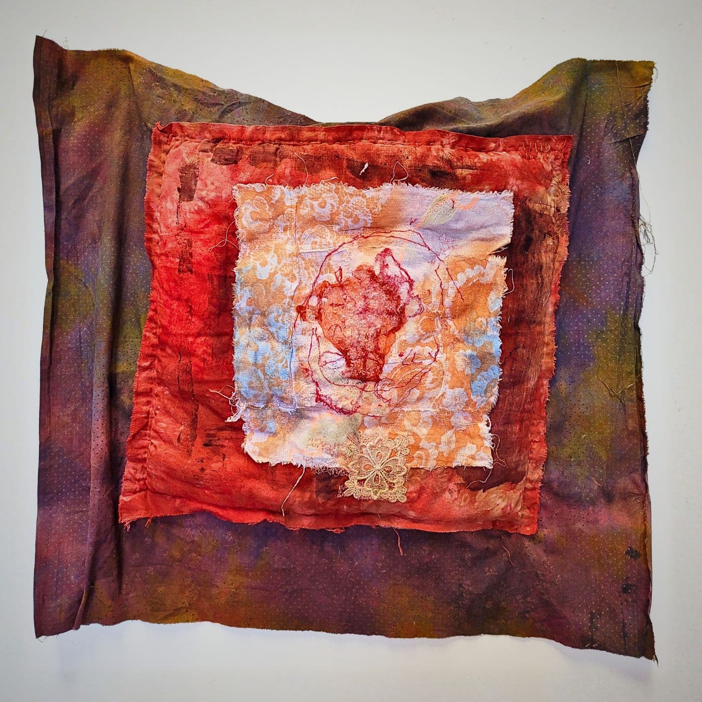 Textile dreamscape artwork with warm, layered colours.