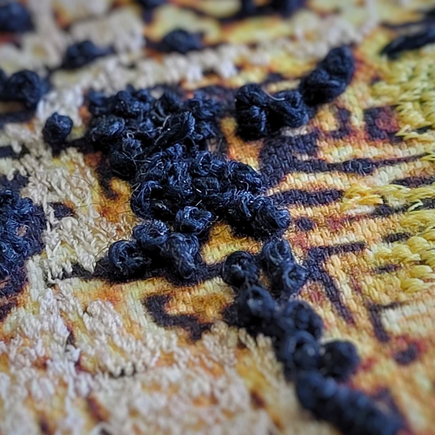 Detailed close up of a stitching sample.