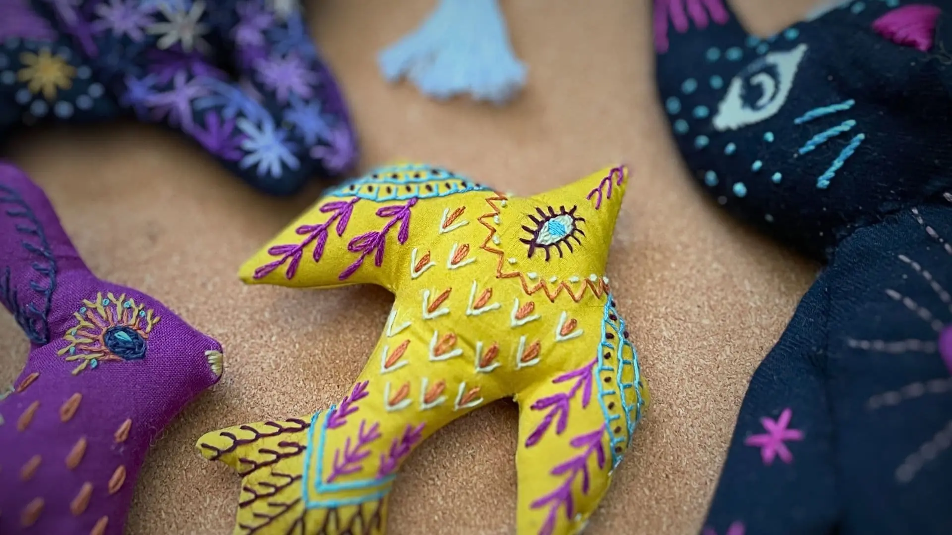 A group of stuffed embroidered animals