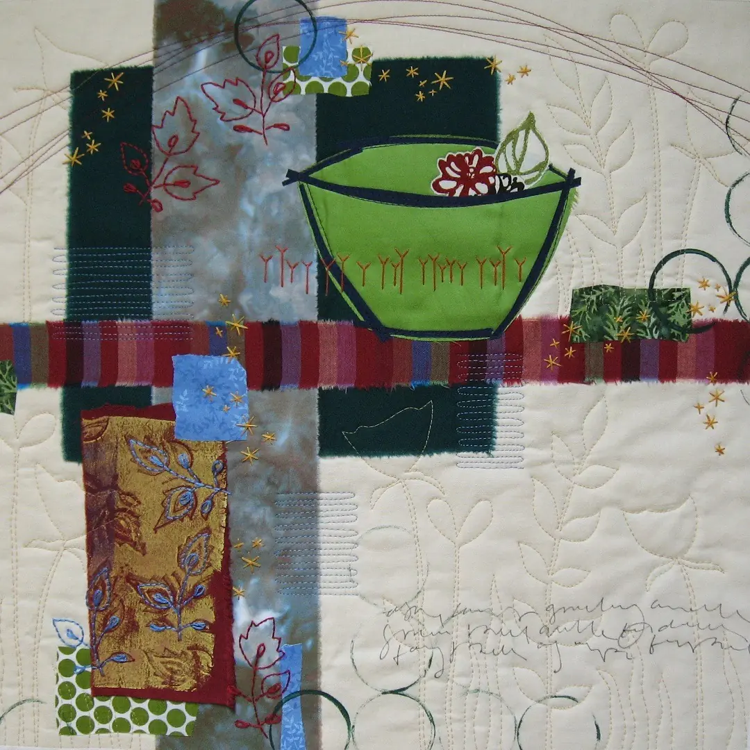 Abstract textile art piece with colourful blocks and green bowl