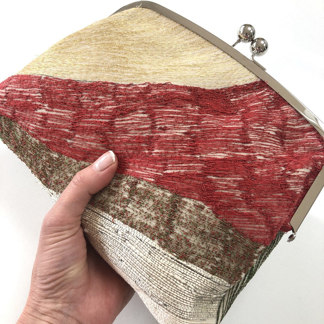 A machine embroidered clutch bag