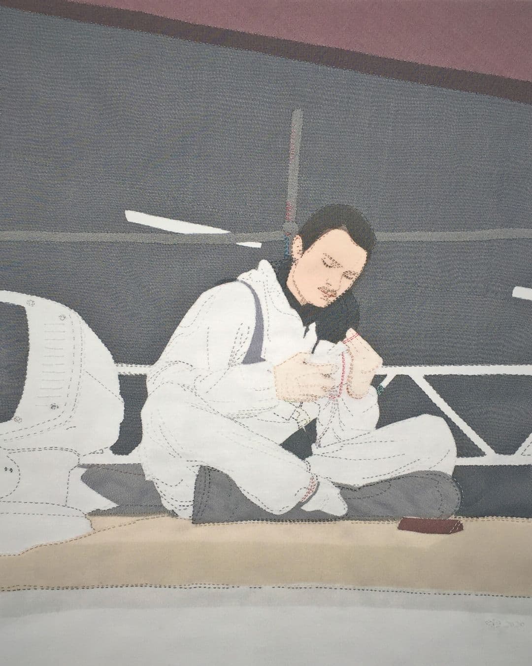 Stitched textile artwork of a boat builder.