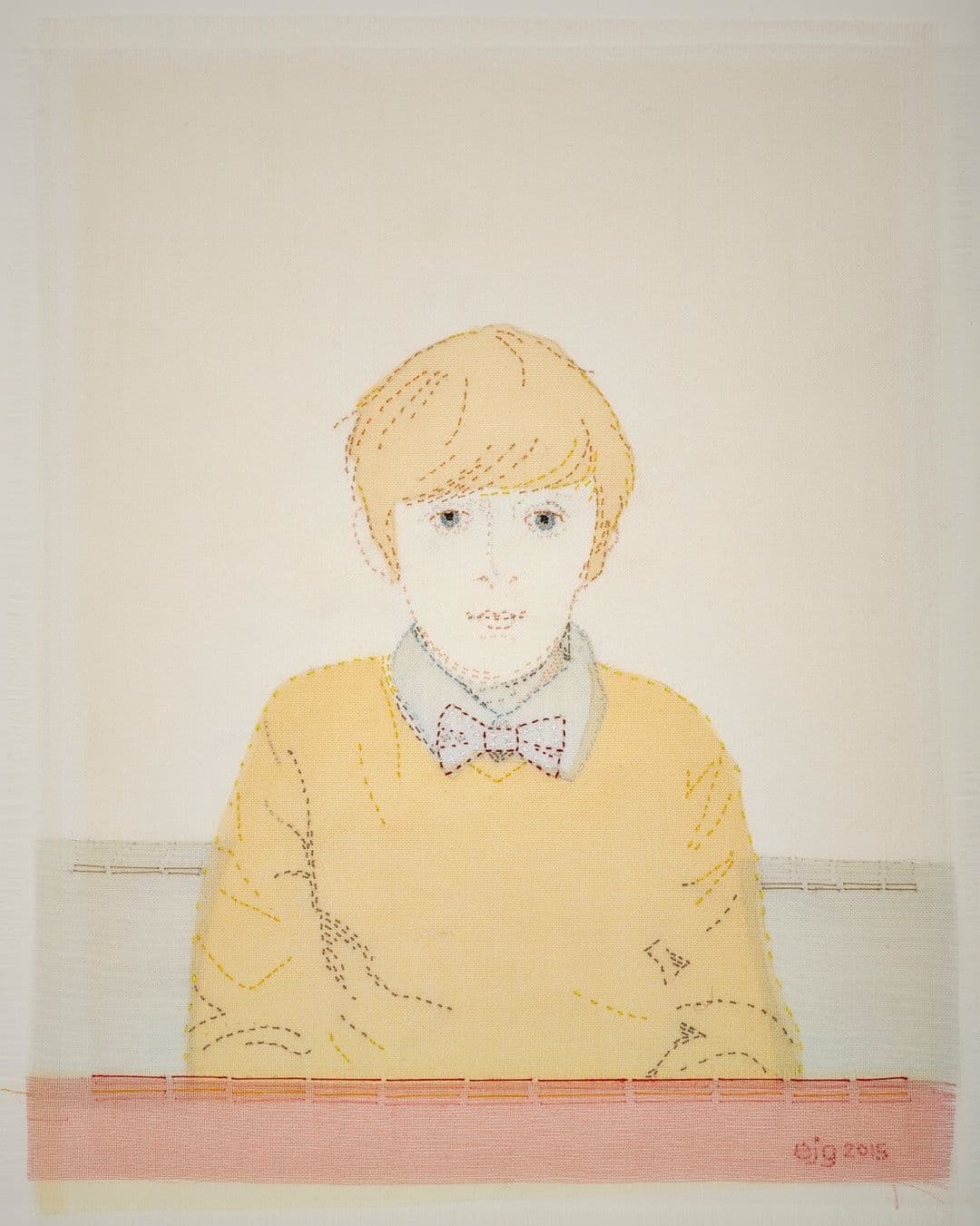 Stitched textile artwork of a boy.