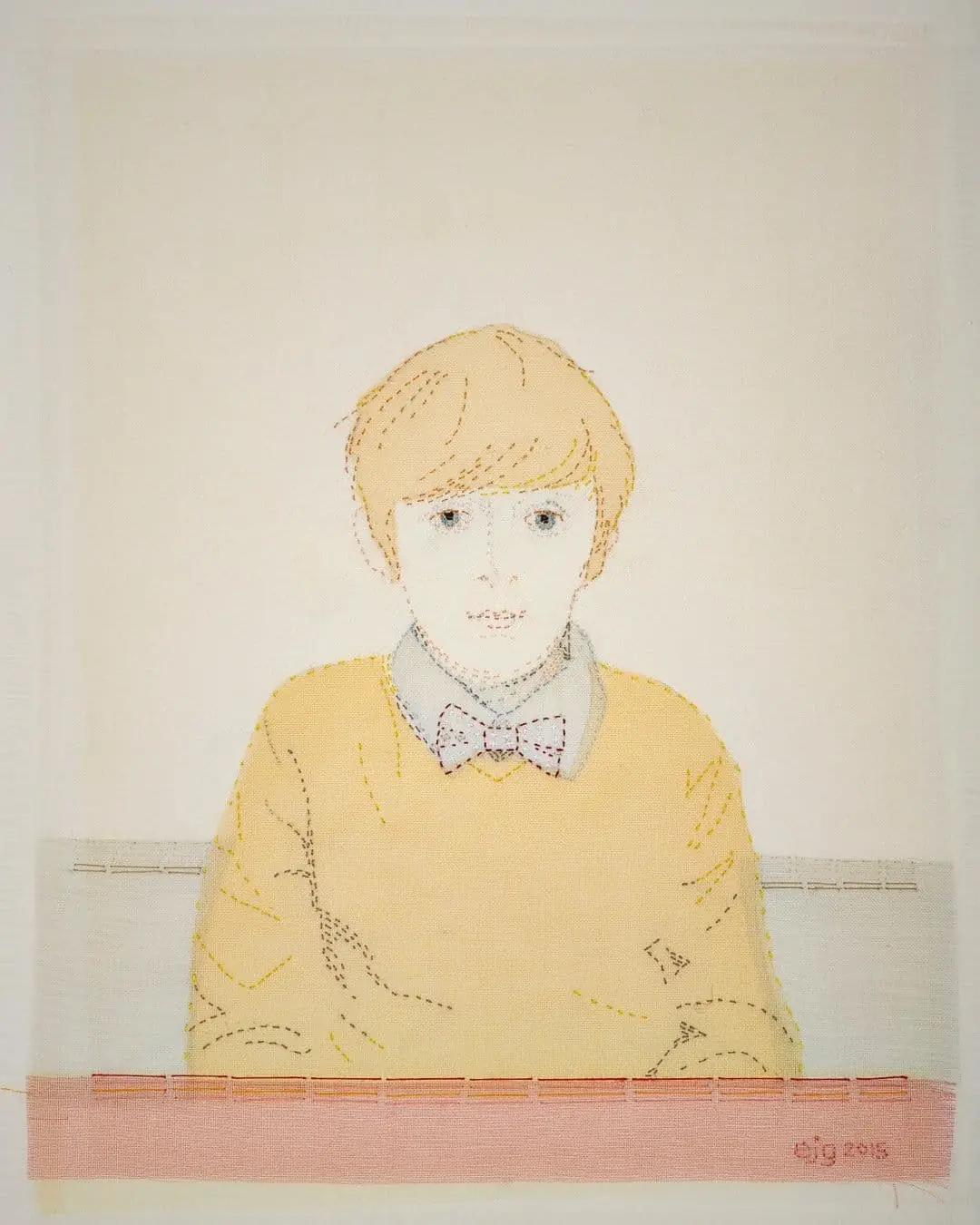 Stitched textile artwork of a boy.