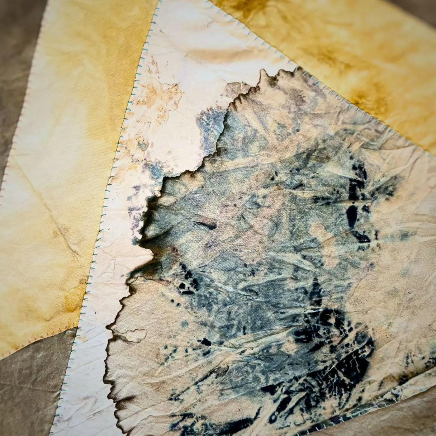 A close up of an abstract stitched artwork