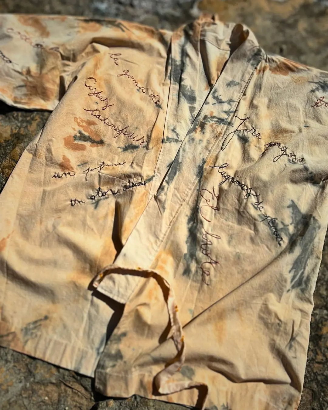 A dress with embroidered writing on it