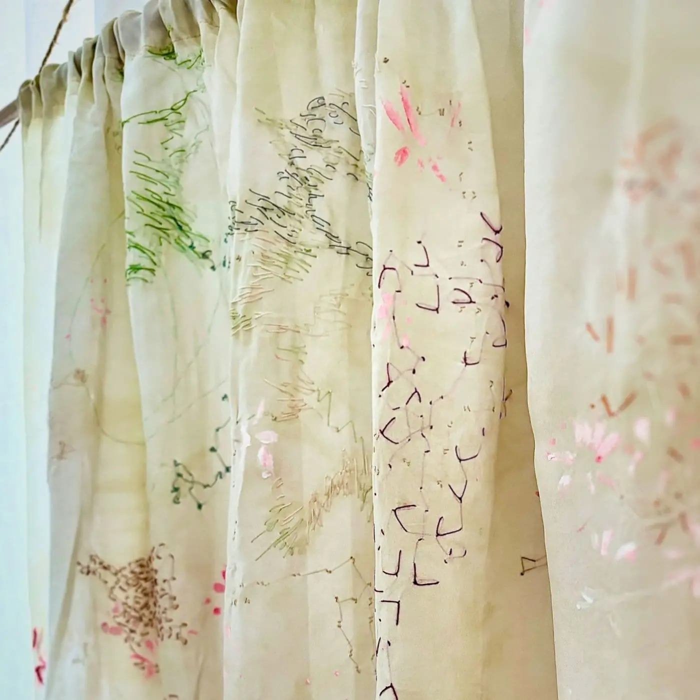 A silk curtain with embroidery on it