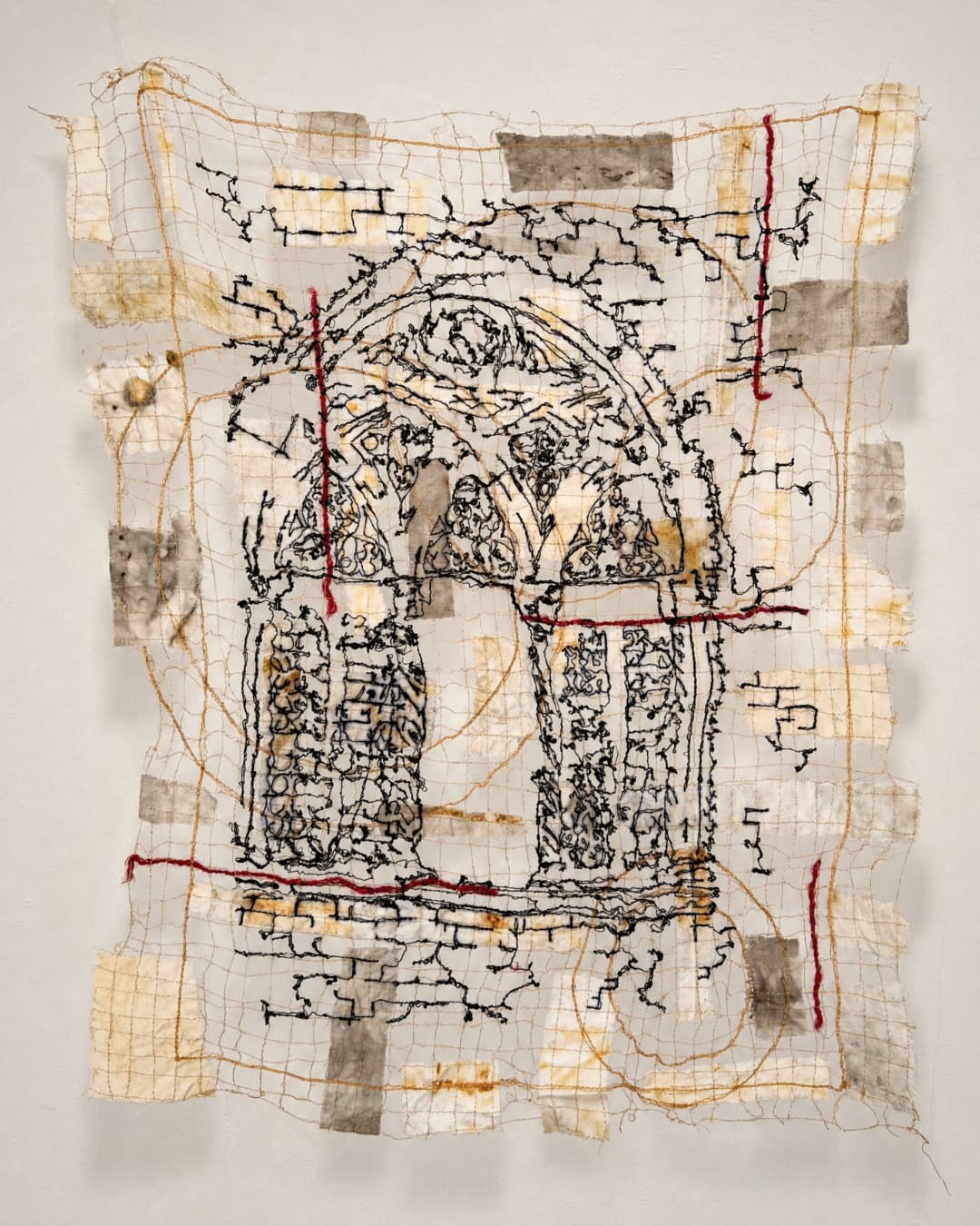 Textile art depicting an architectural arch.