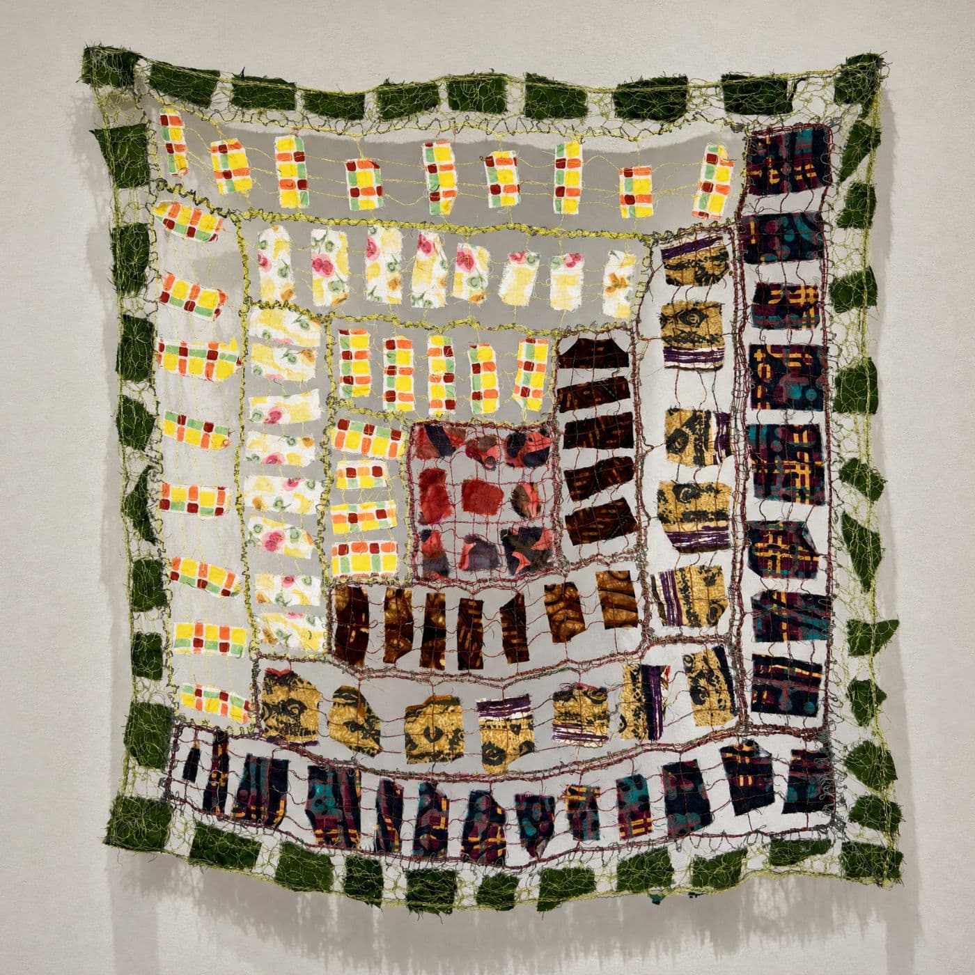 Colourful textile artwork with intricate patterns.