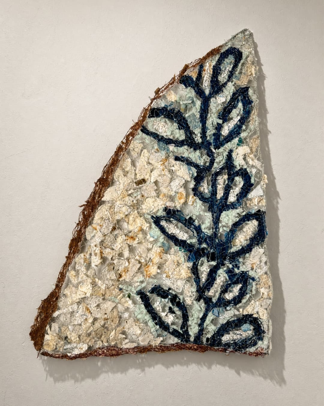 Textured artwork with floral design.