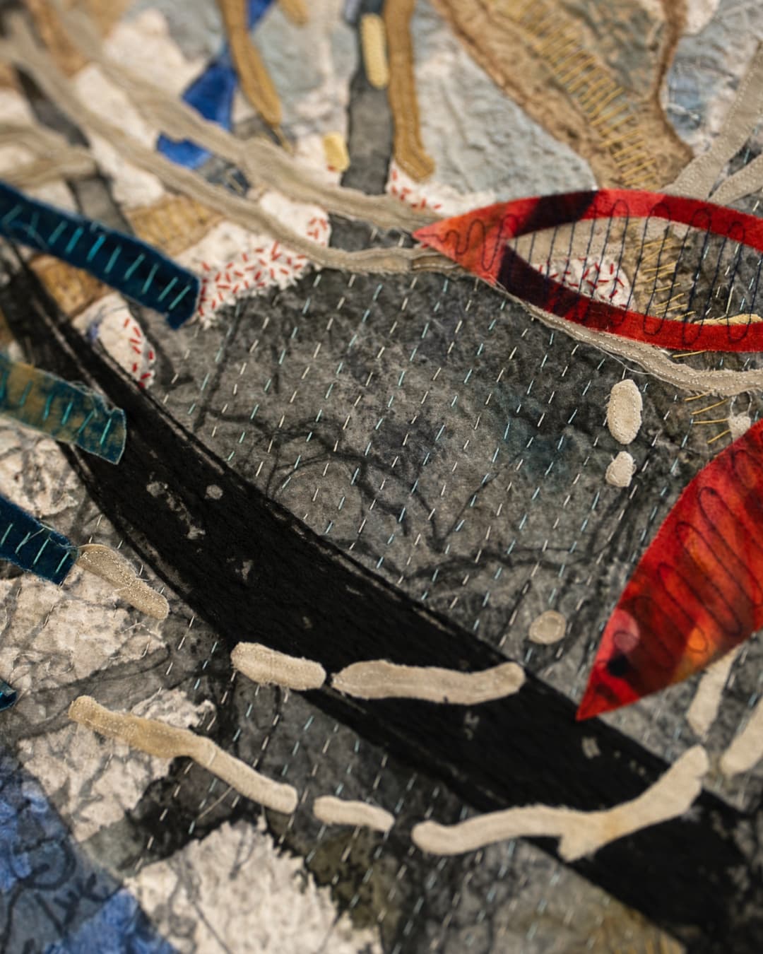 Abstract textile art with vibrant colours.