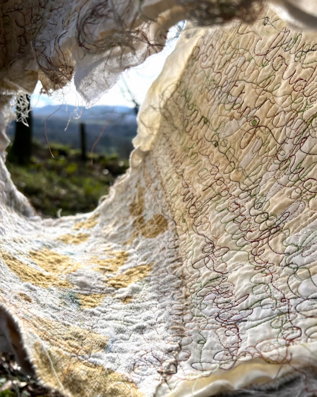 Textured fabric with intricate stitching details.
