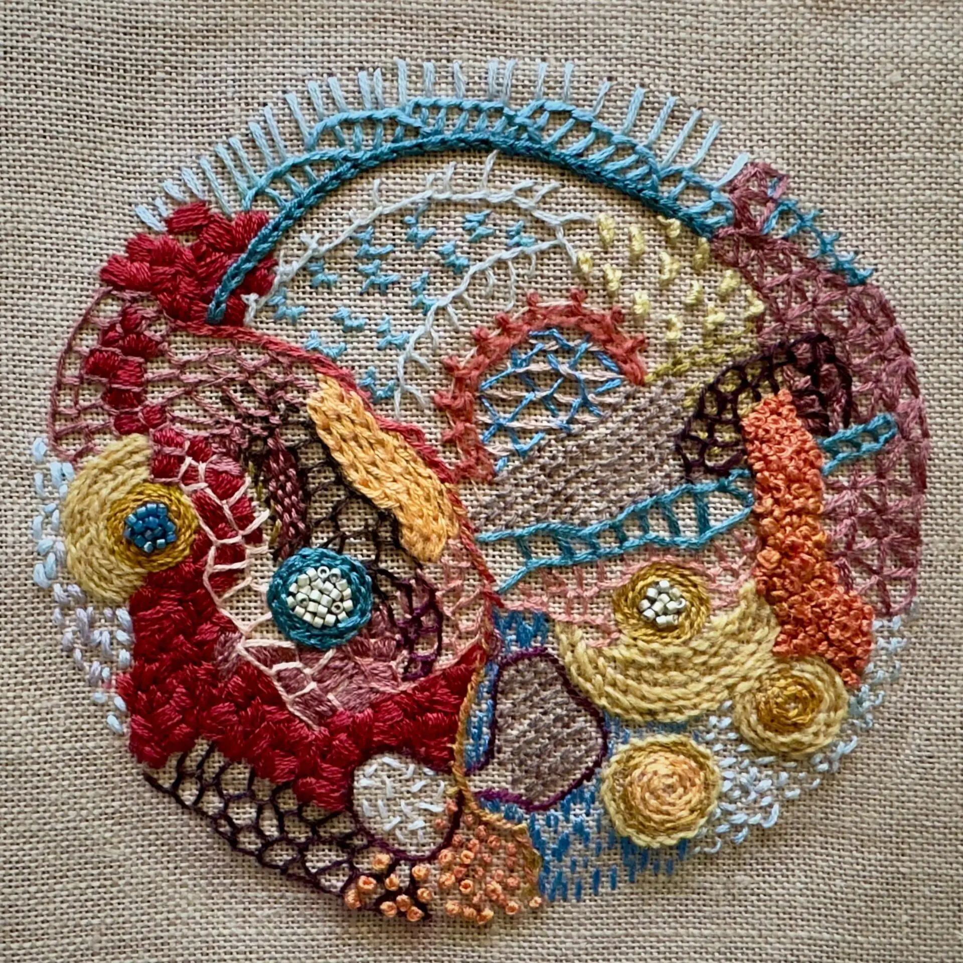 Colourful embroidered abstract textile art