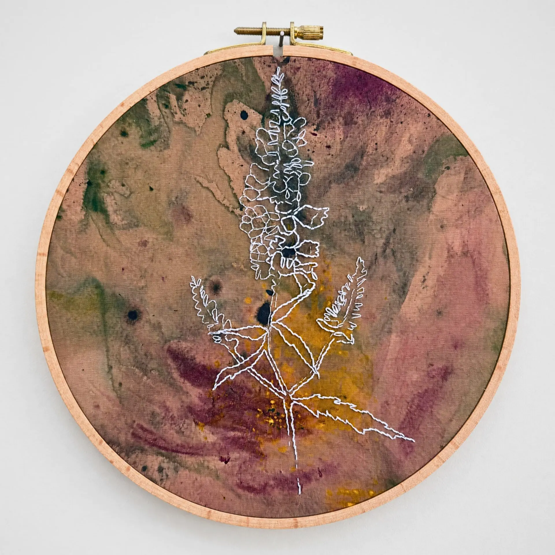 Embroidery of a flower on fabric.