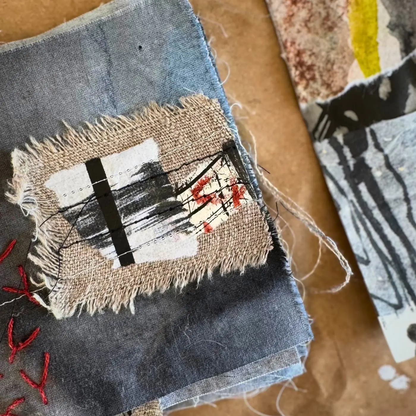 Textile collage with abstract patterns.