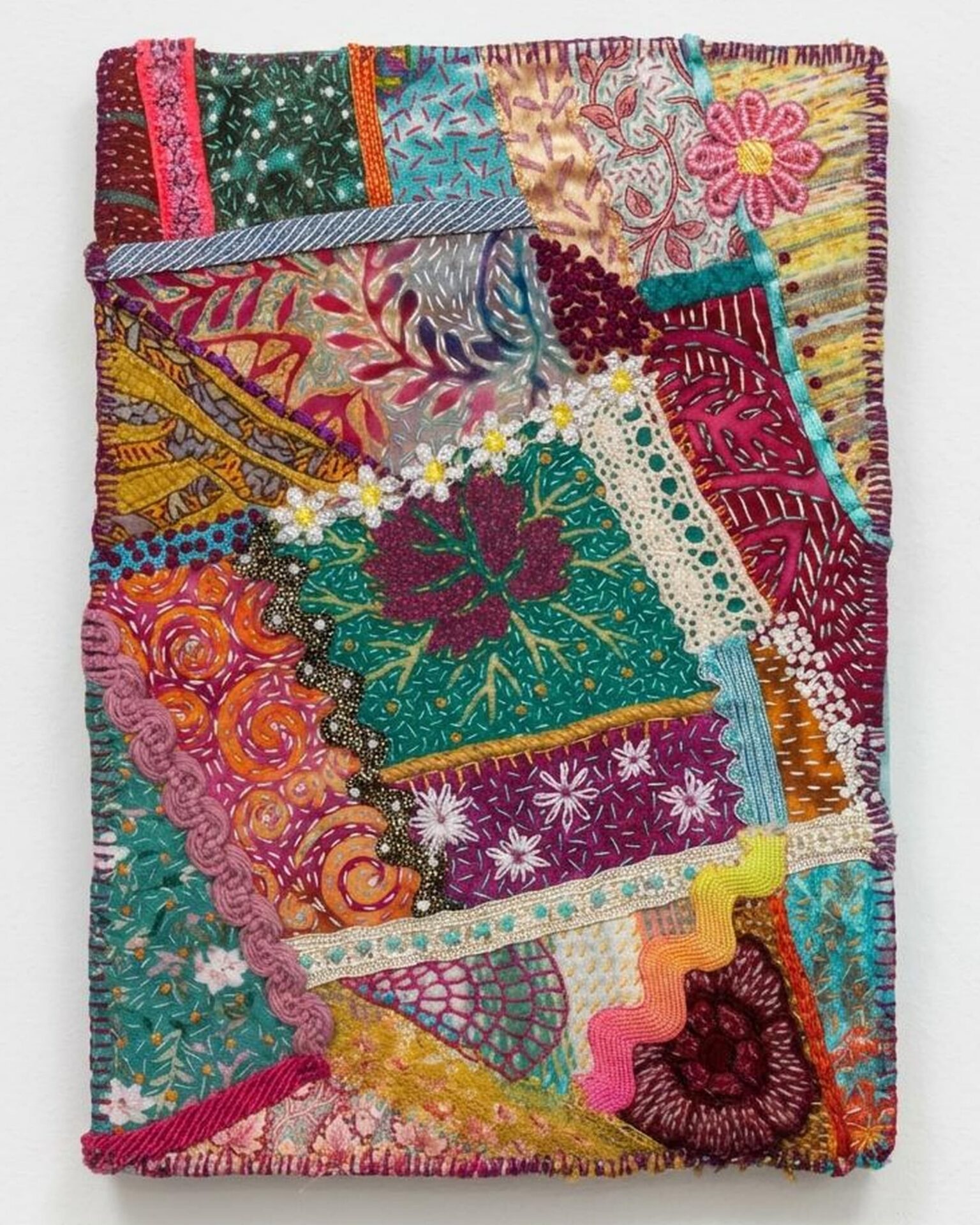 Colourful patchwork quilt book cover.