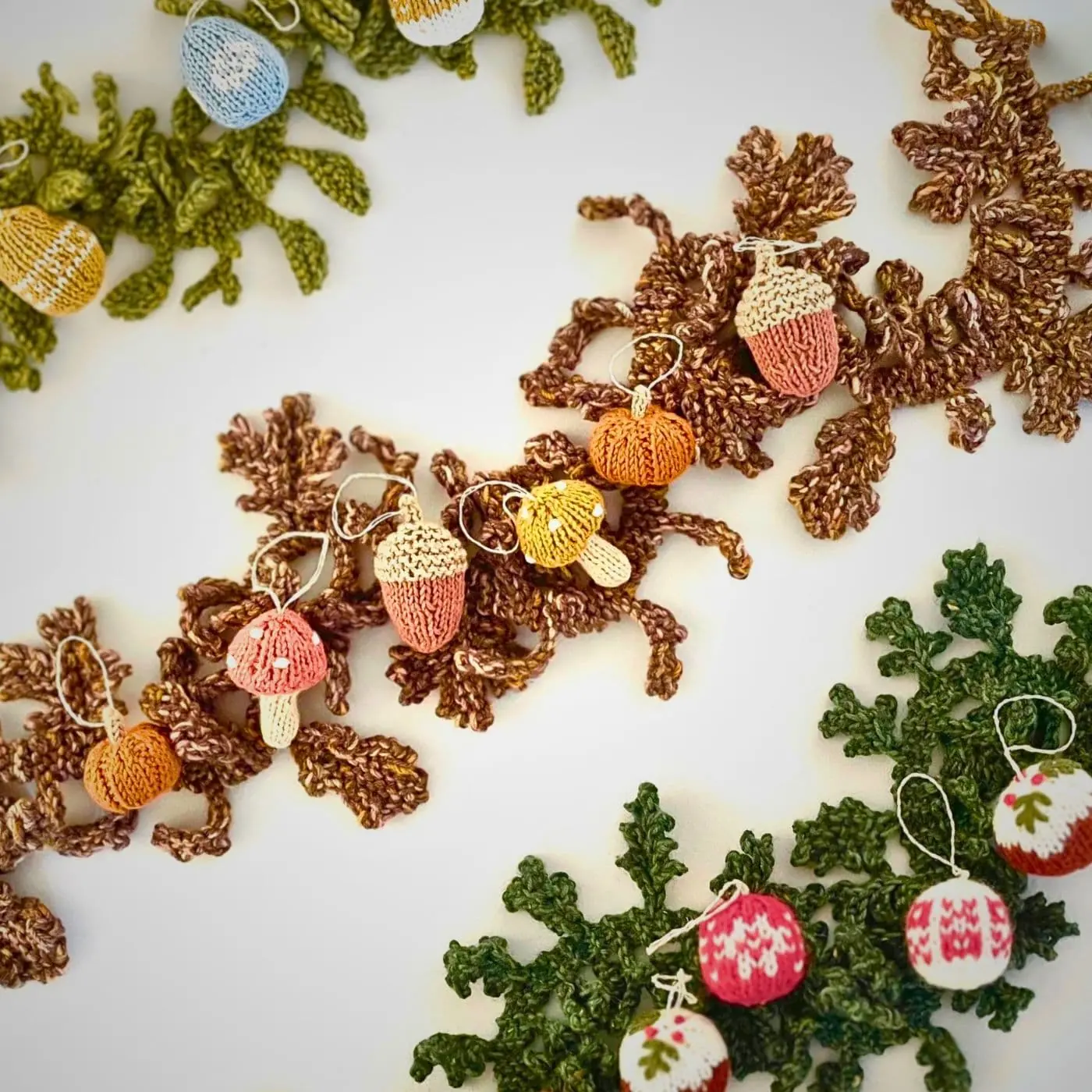 A group of knitted seasonal garlands