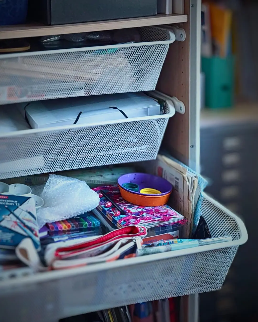 A drawer full of art supplies