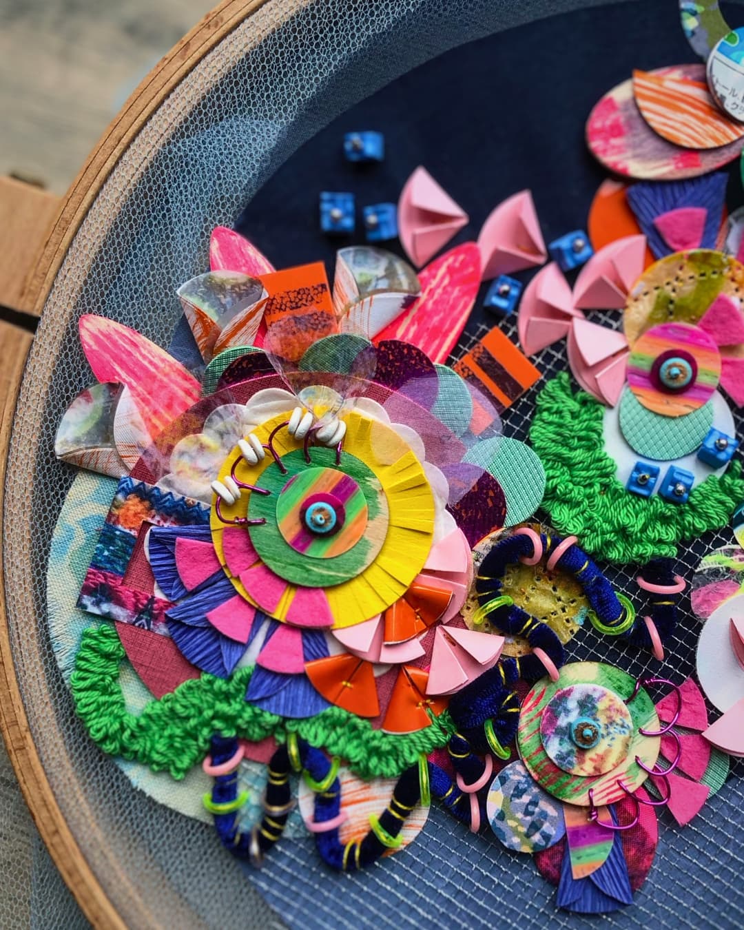 Jessica Grady, Cosmos 2, 2025. Hand stitch. Leatherette, organza, netting, painted fabrics, fused plastic sequins, foam, painted wooden embellishments, couched velvet thread.