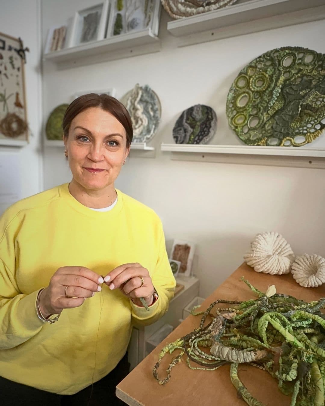 Mixed Media Artist Julia Wright  in her studio.