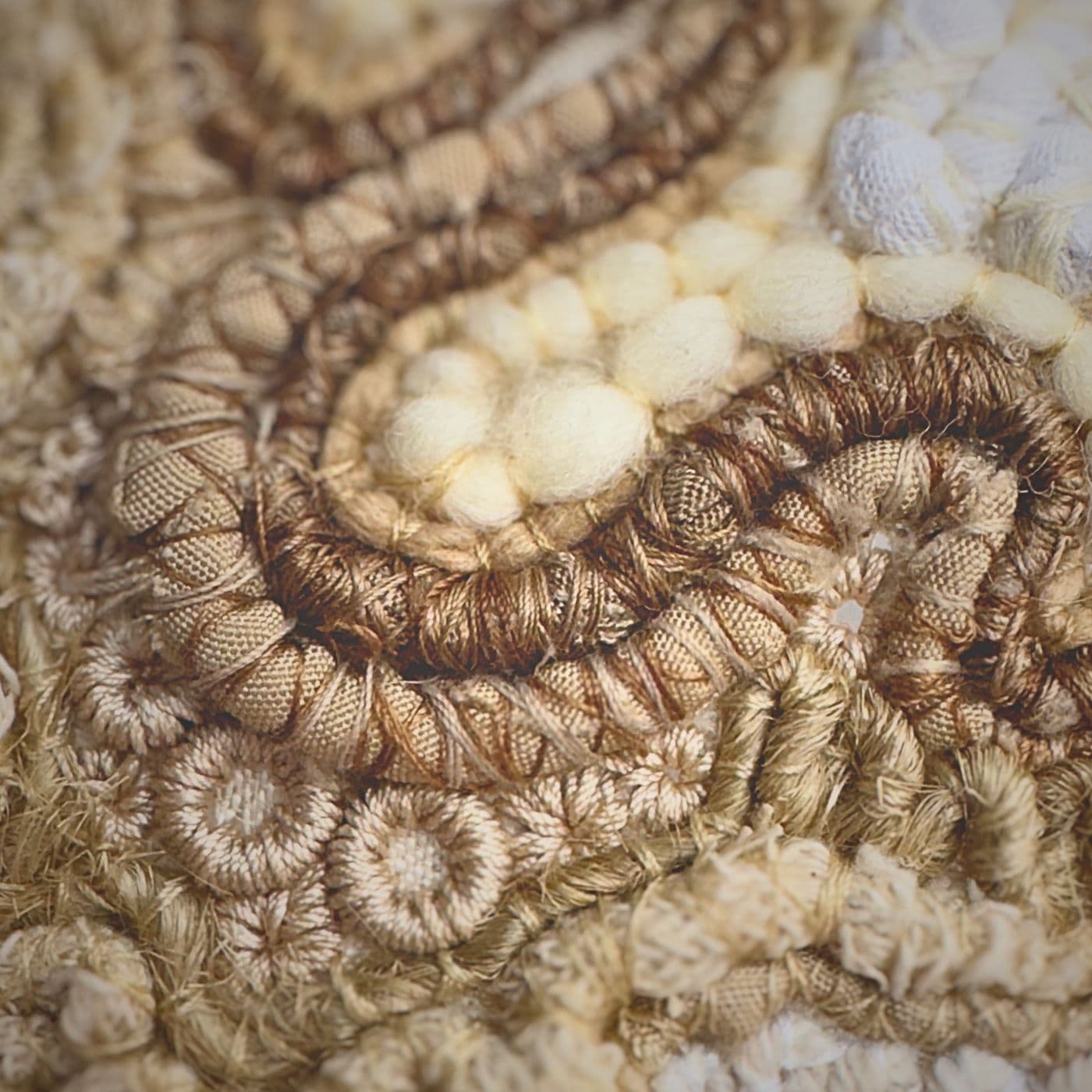 A close up of an embroidered fabric.