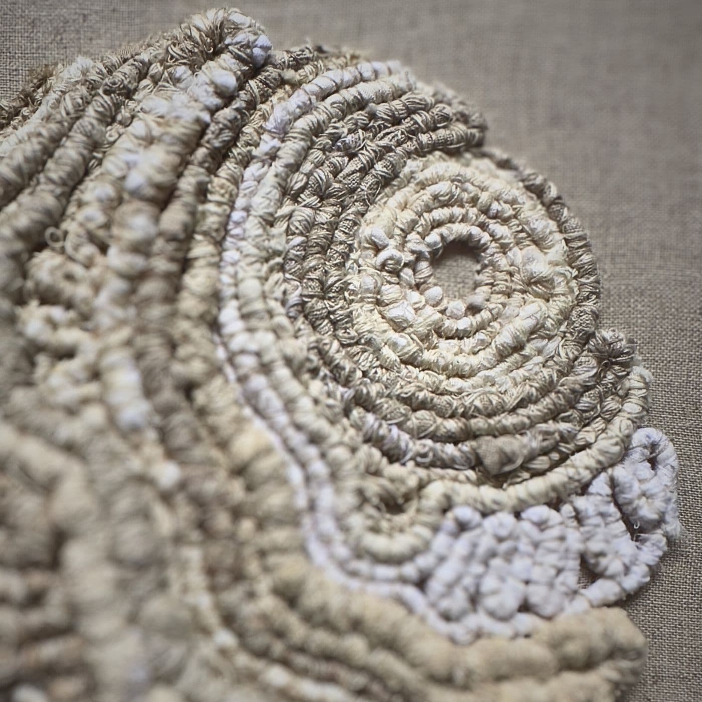 A close up of a mixed thread textile.