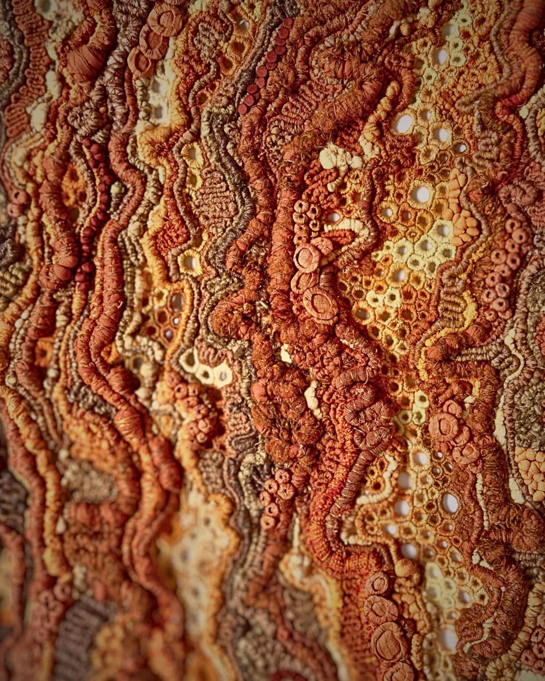 An embroidered artwork using cotton, linen, silk & banana yarn.