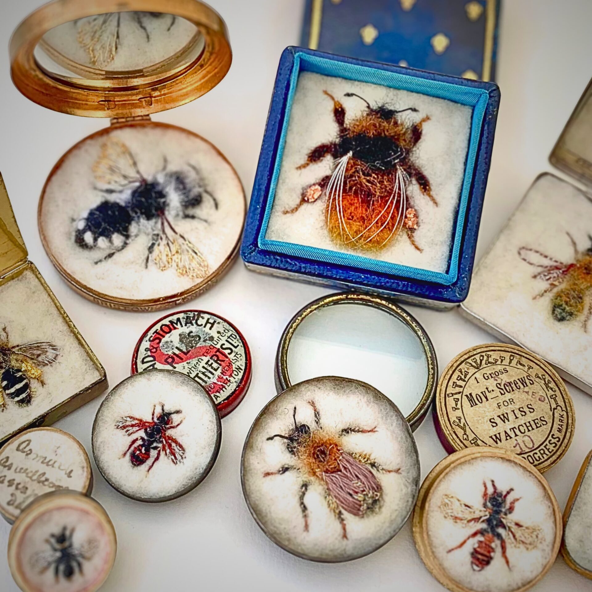 Intricate bee-themed needlework displays.