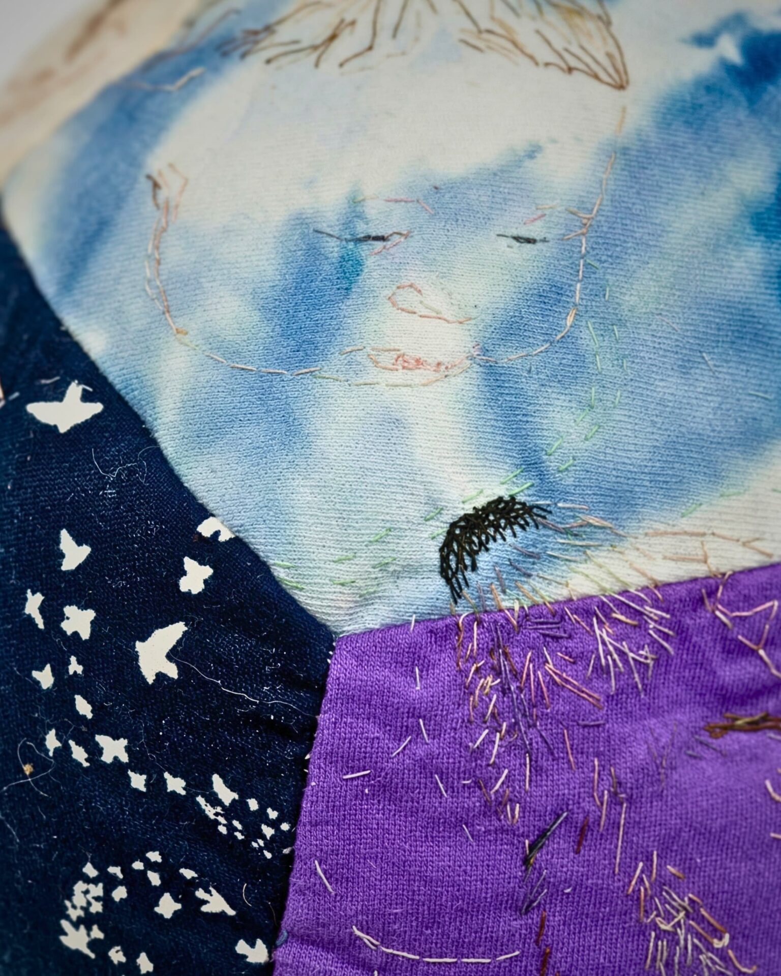 Colourful patchwork with embroidered details.