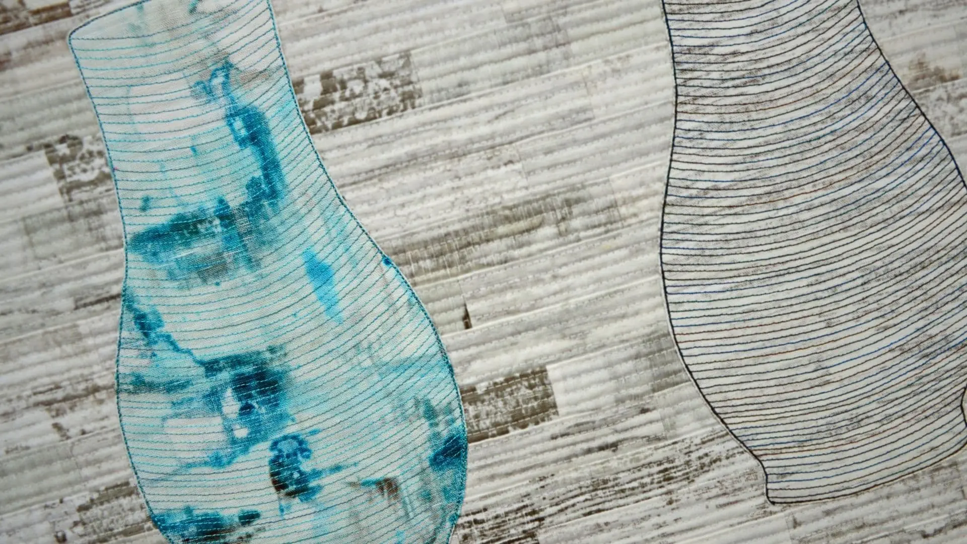 Close up of textile work on cotton/ linen blend fabric.