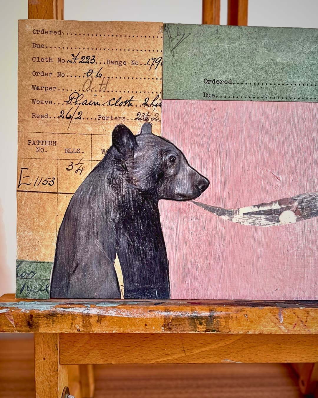 Black bear illustration on vintage collaged paper