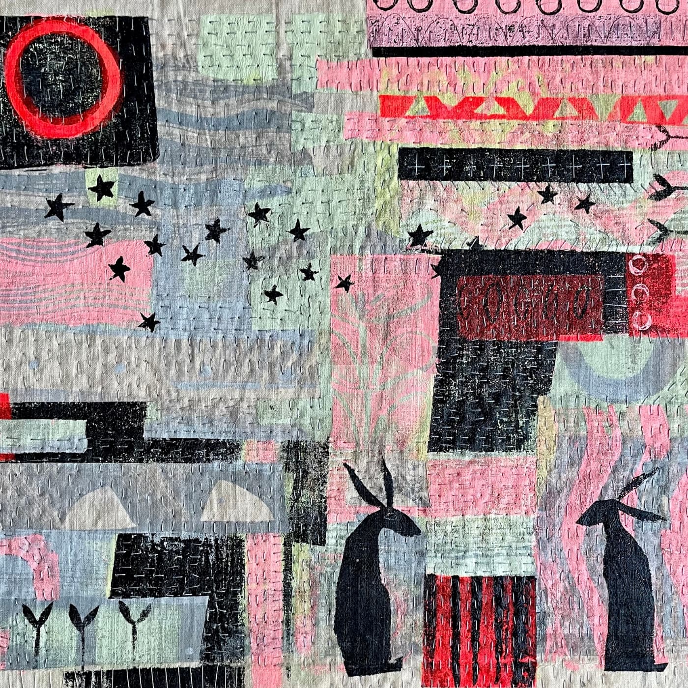 Colourful fabric collage with embroidered stitch, featuring stylised hares, stars and leaves.