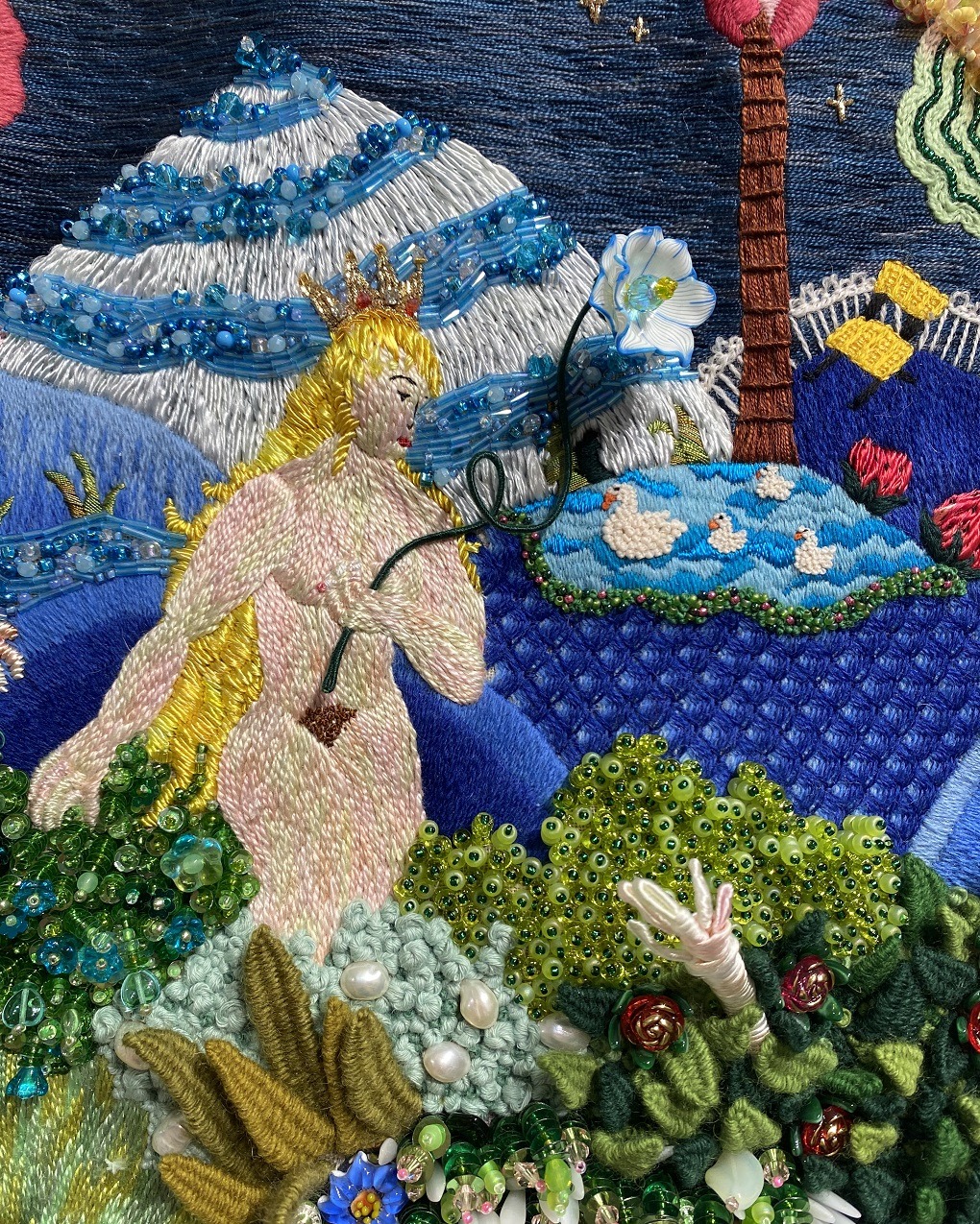 Mixed media piece of art of a naked lady in amongst plants and mountains