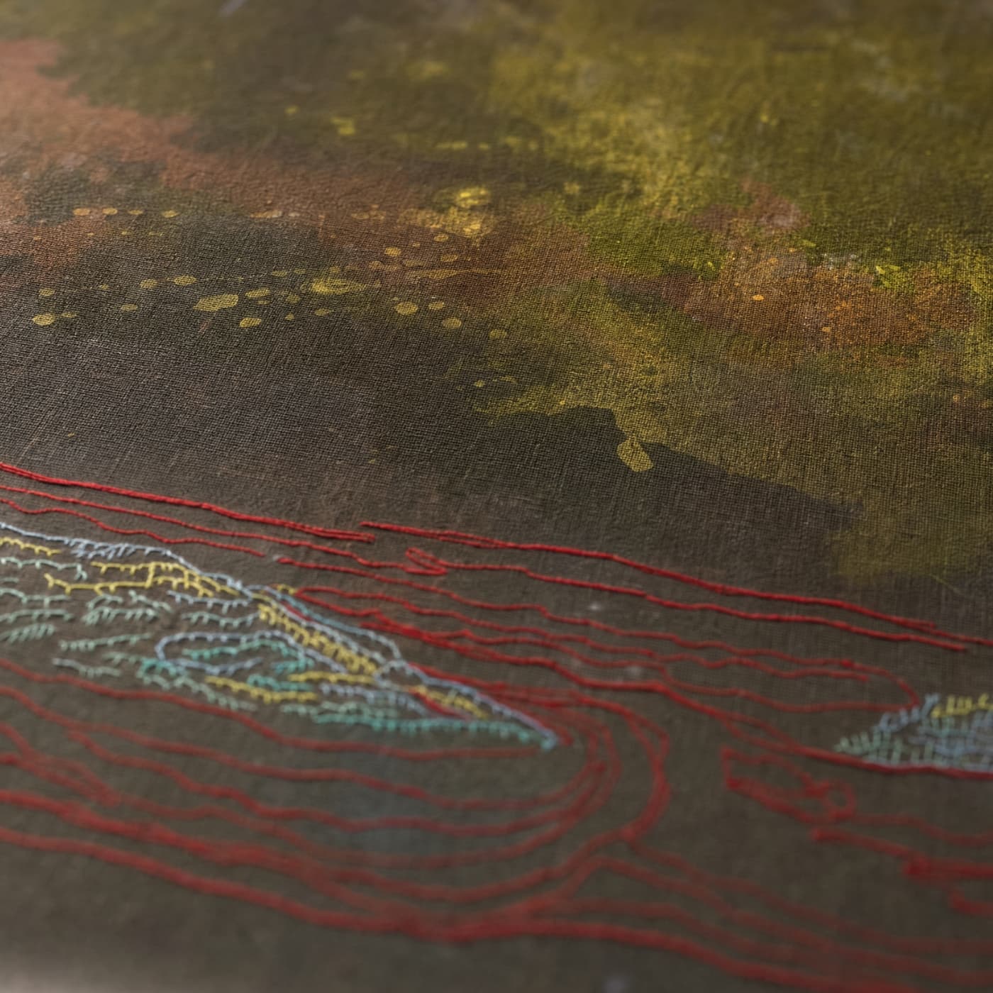 Abstract textile artwork with textured patterns.