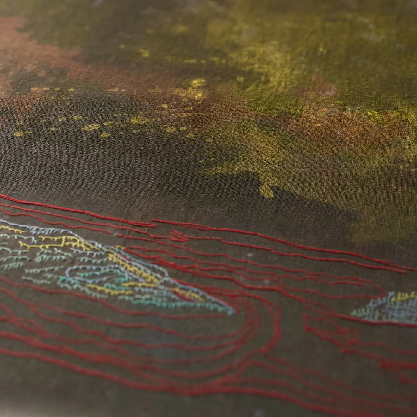 Abstract textile artwork with textured patterns.