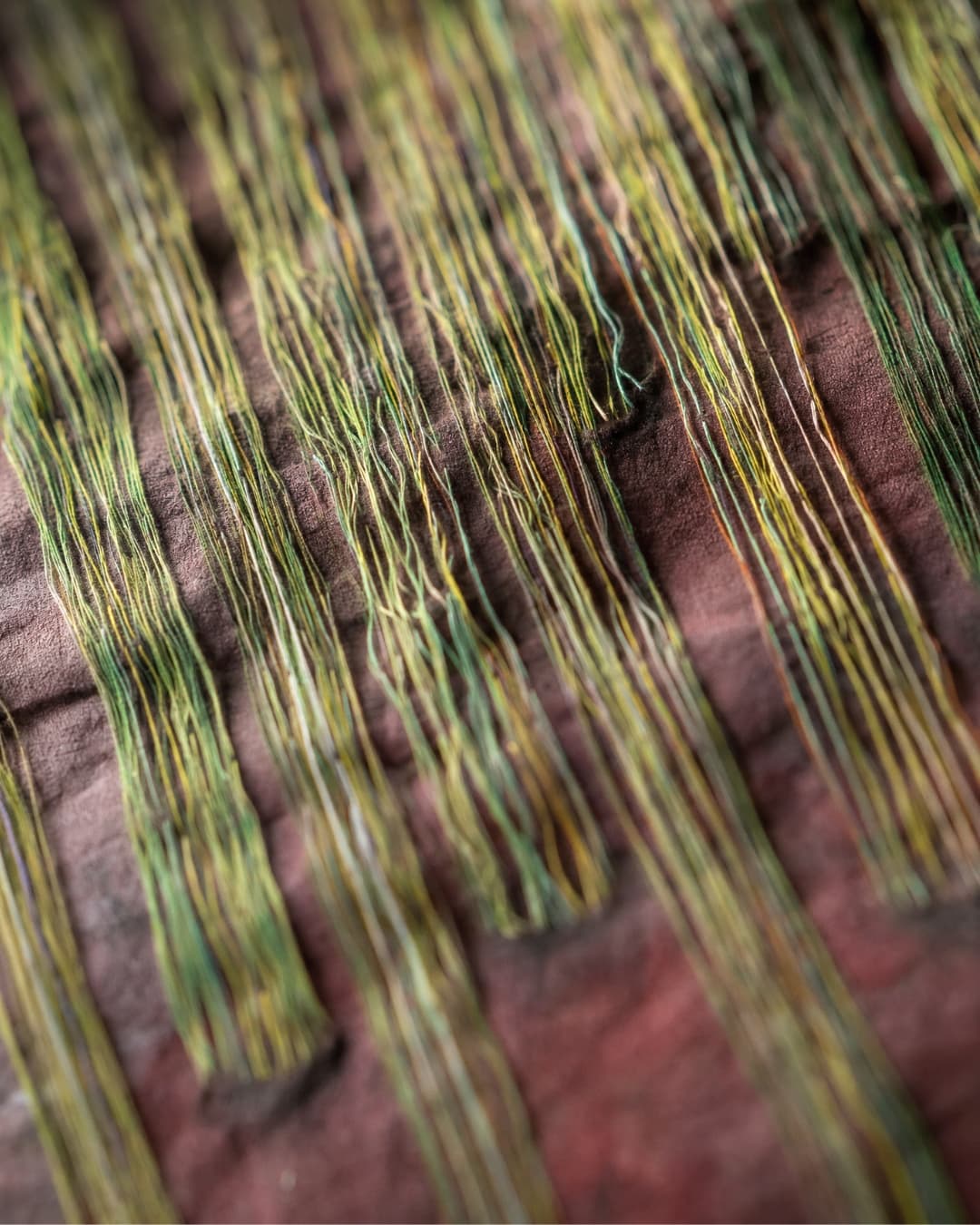 Intricate threads in earthy tones.