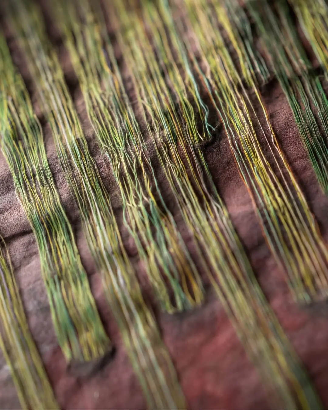 Intricate threads in earthy tones.