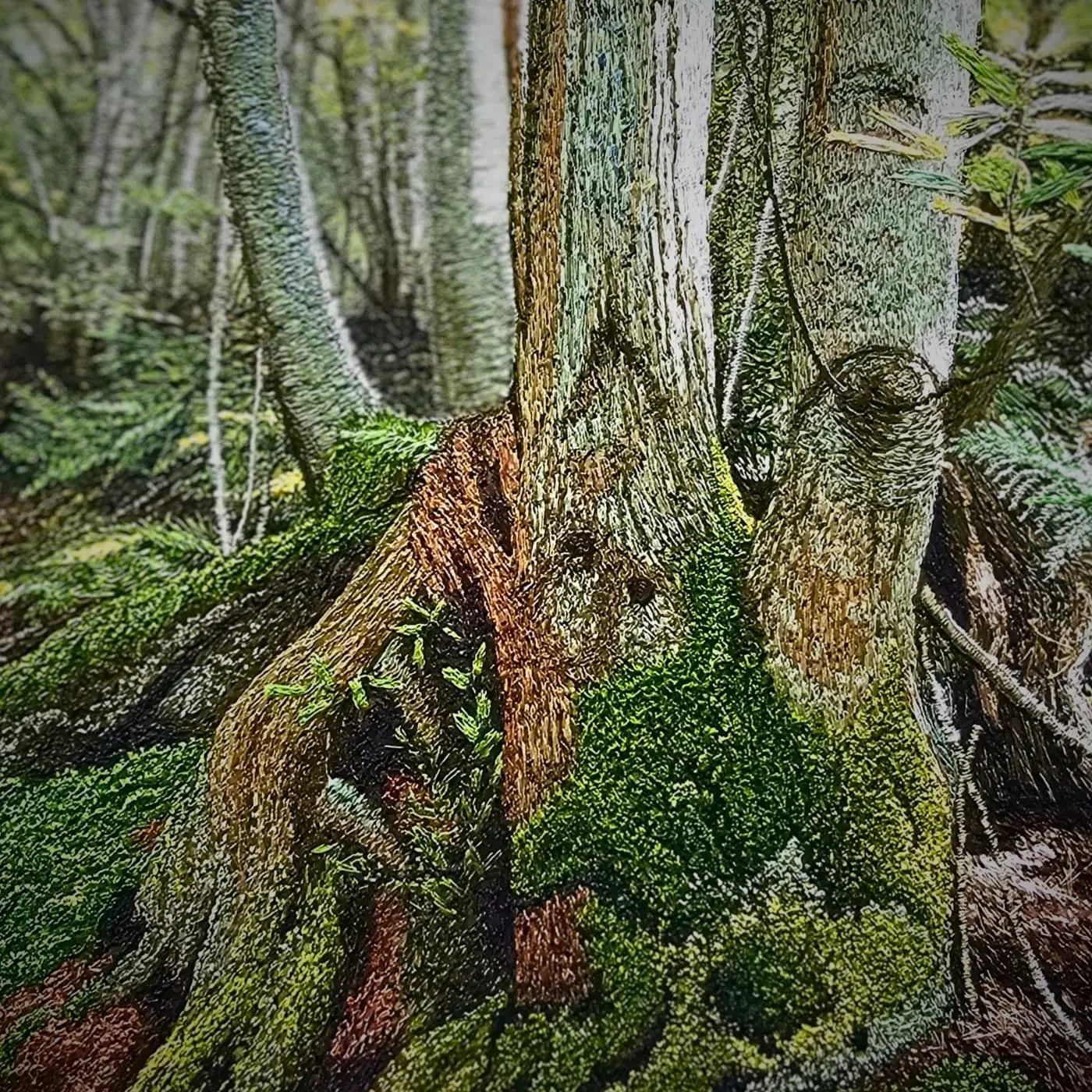 A machine embroidered piece of art showing tree trunk with moss growing on it