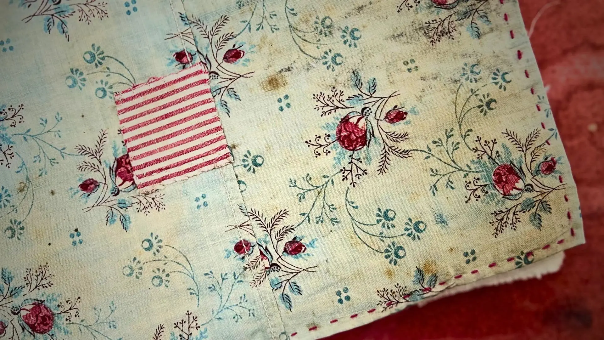 a textile collage of a fabric book