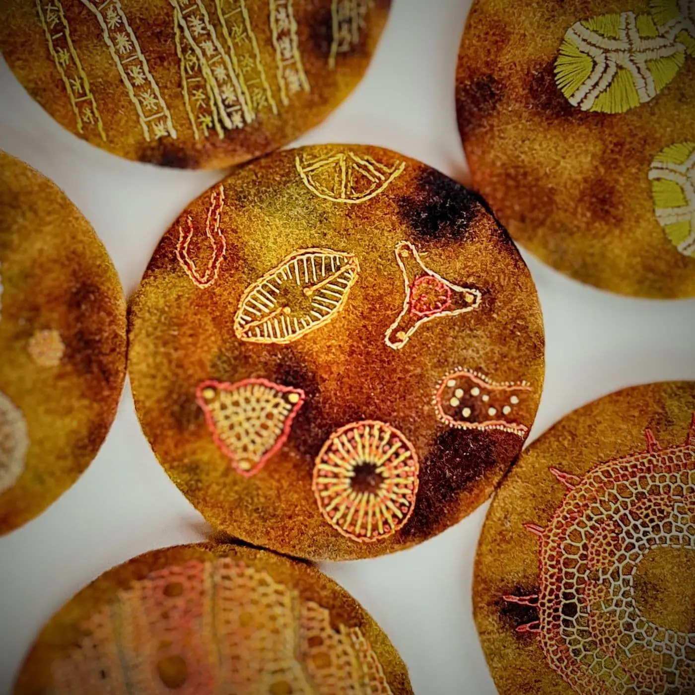 A group of circular objects with embroidery
