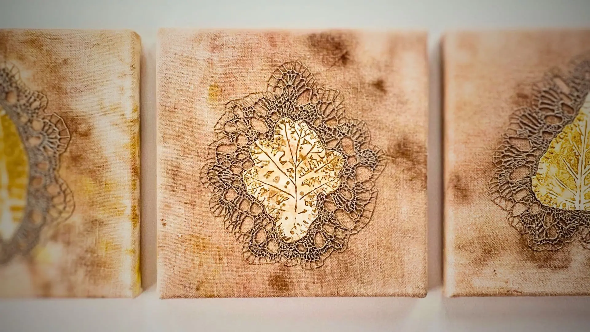 3 square textile art pieces featuring leaves with embroidery