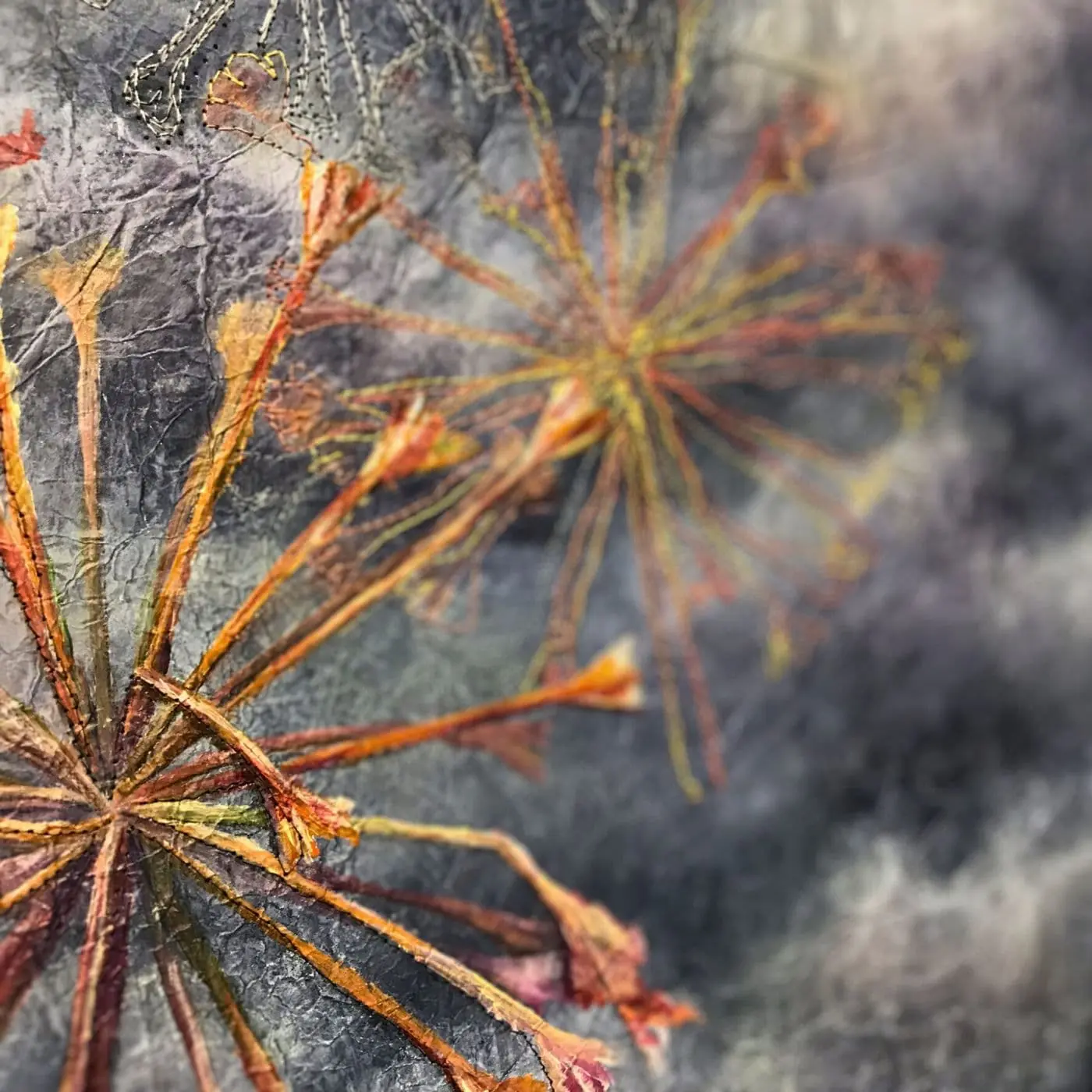 A close up of a stitched flower