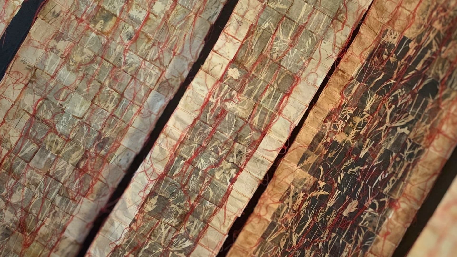 A close up of a textile art piece