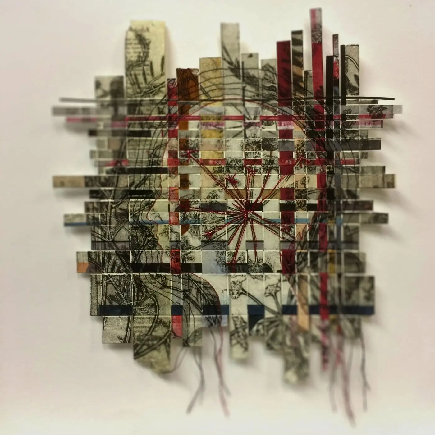 A piece of textile art on a wall
