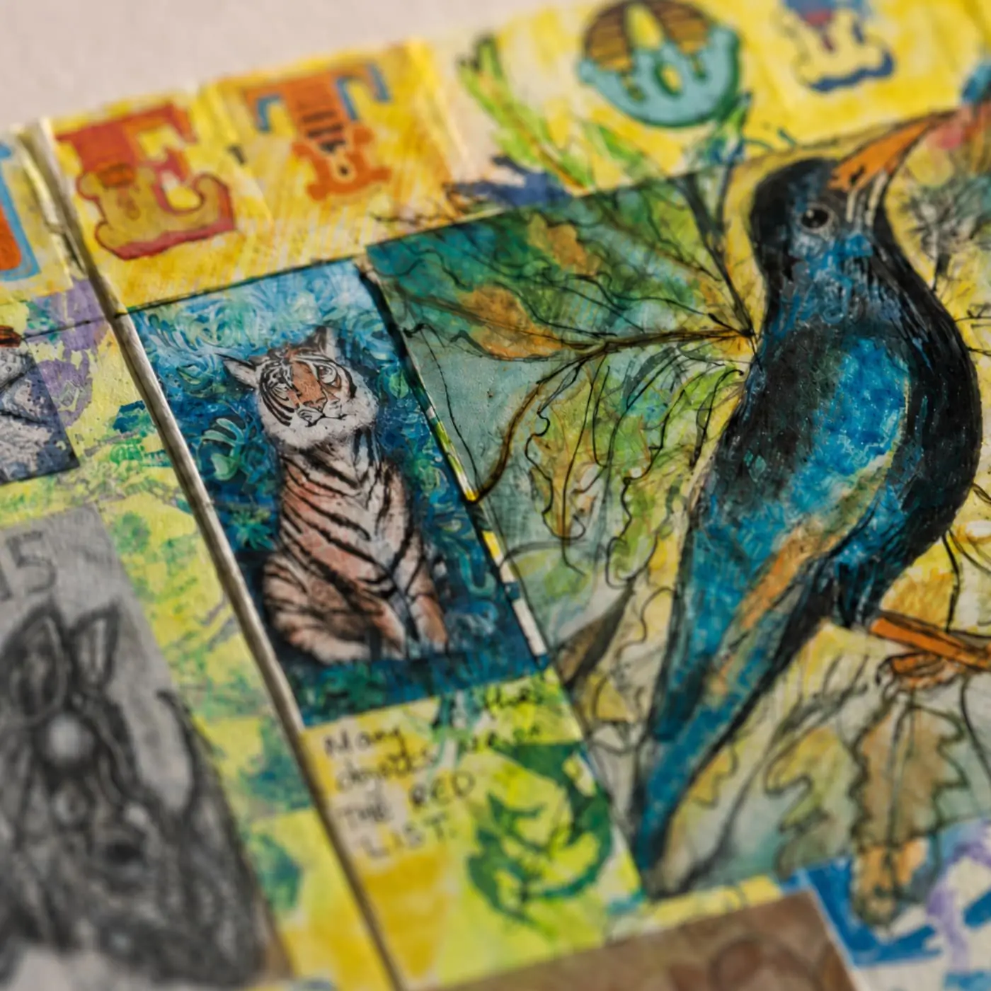Colourful textile collage featuring animals and nature.
