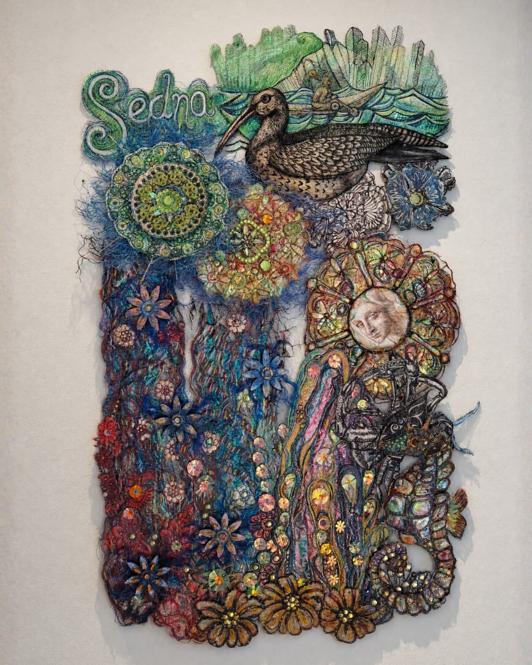 Colourful textile art depicting nature themes.